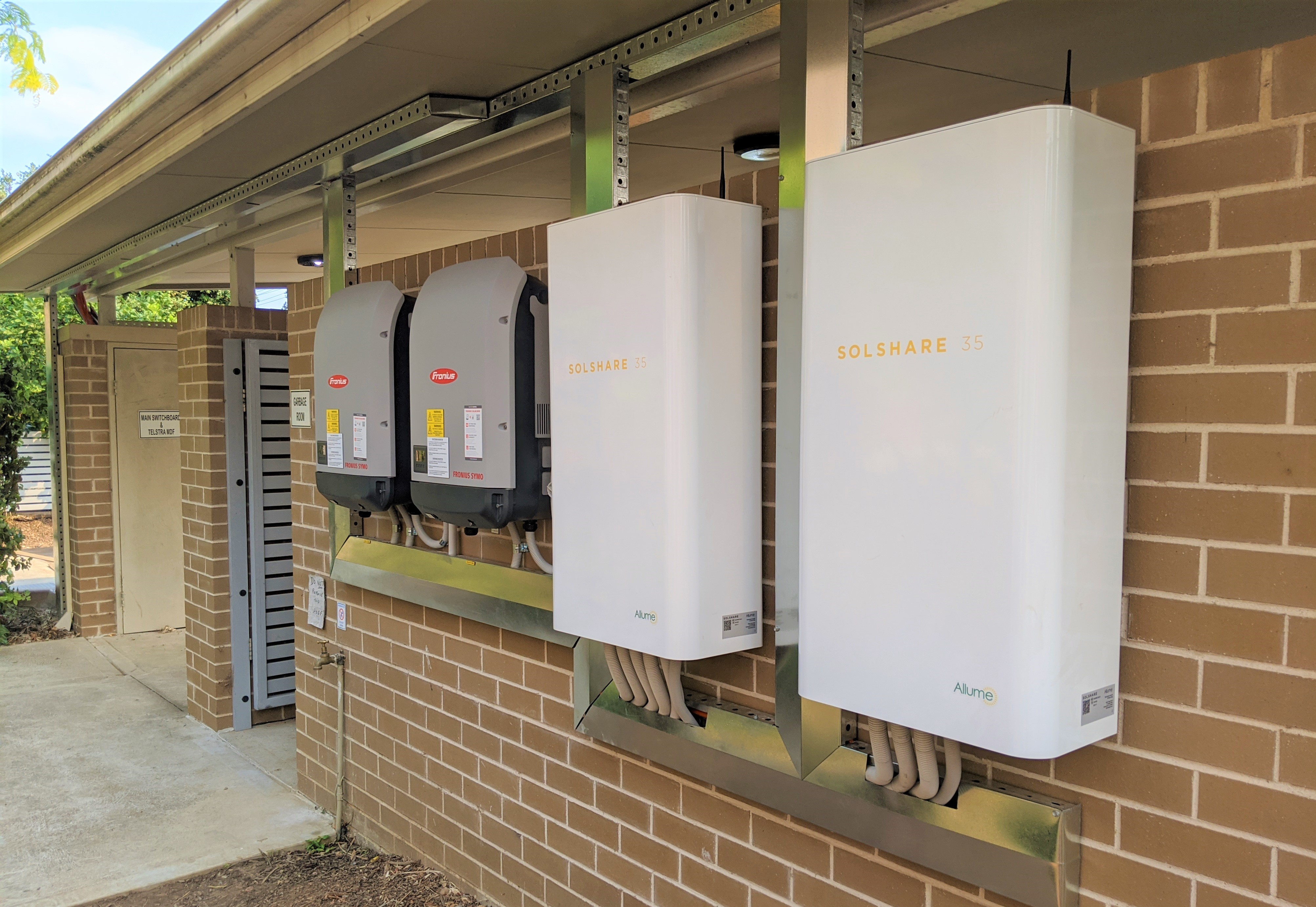 Two SolShares installed on an apartment building